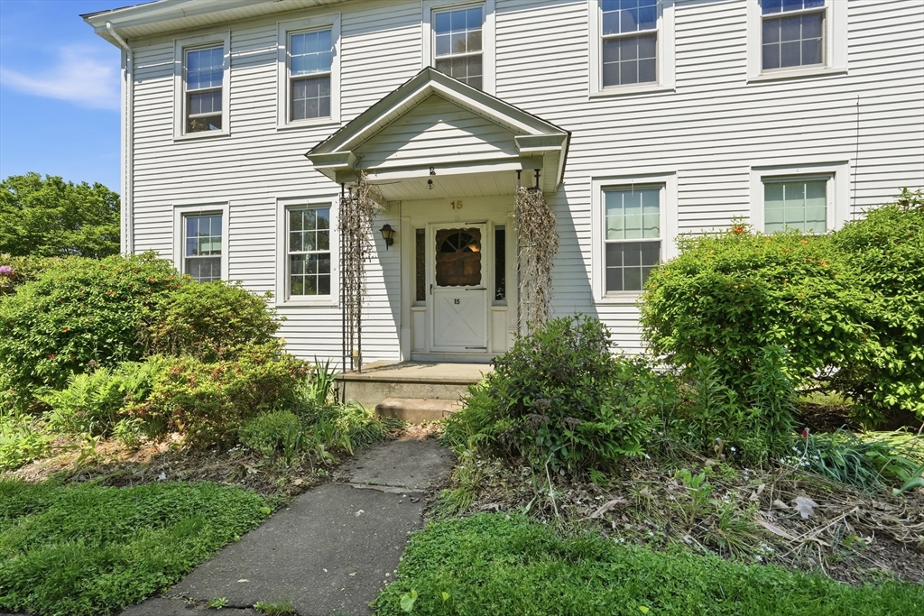 15 Main Street Hatfield, MA 01038 - Photo 4 of 42 a view of a house with brick walls and potted plants
