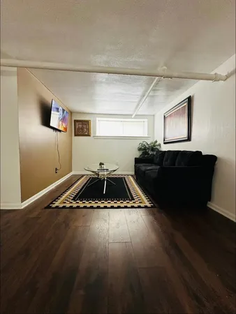 a kitchen with wooden floors and a sink