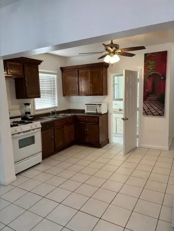 a kitchen with stainless steel appliances granite countertop a sink and cabinets