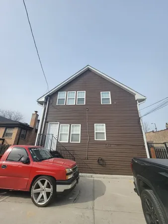 a front view of a house with parking