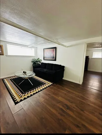 a black and white photo of a living room