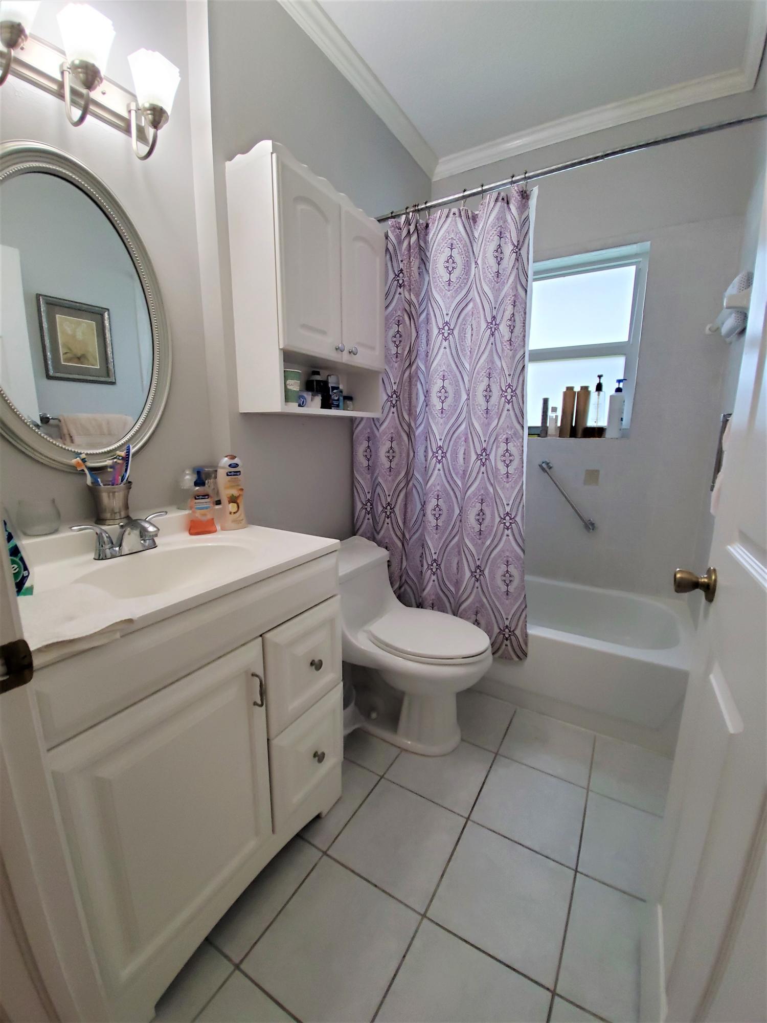 9897 Sandy Run Road Jupiter, FL 33478 - Photo 12 of 30 a bathroom with a sink toilet and shower