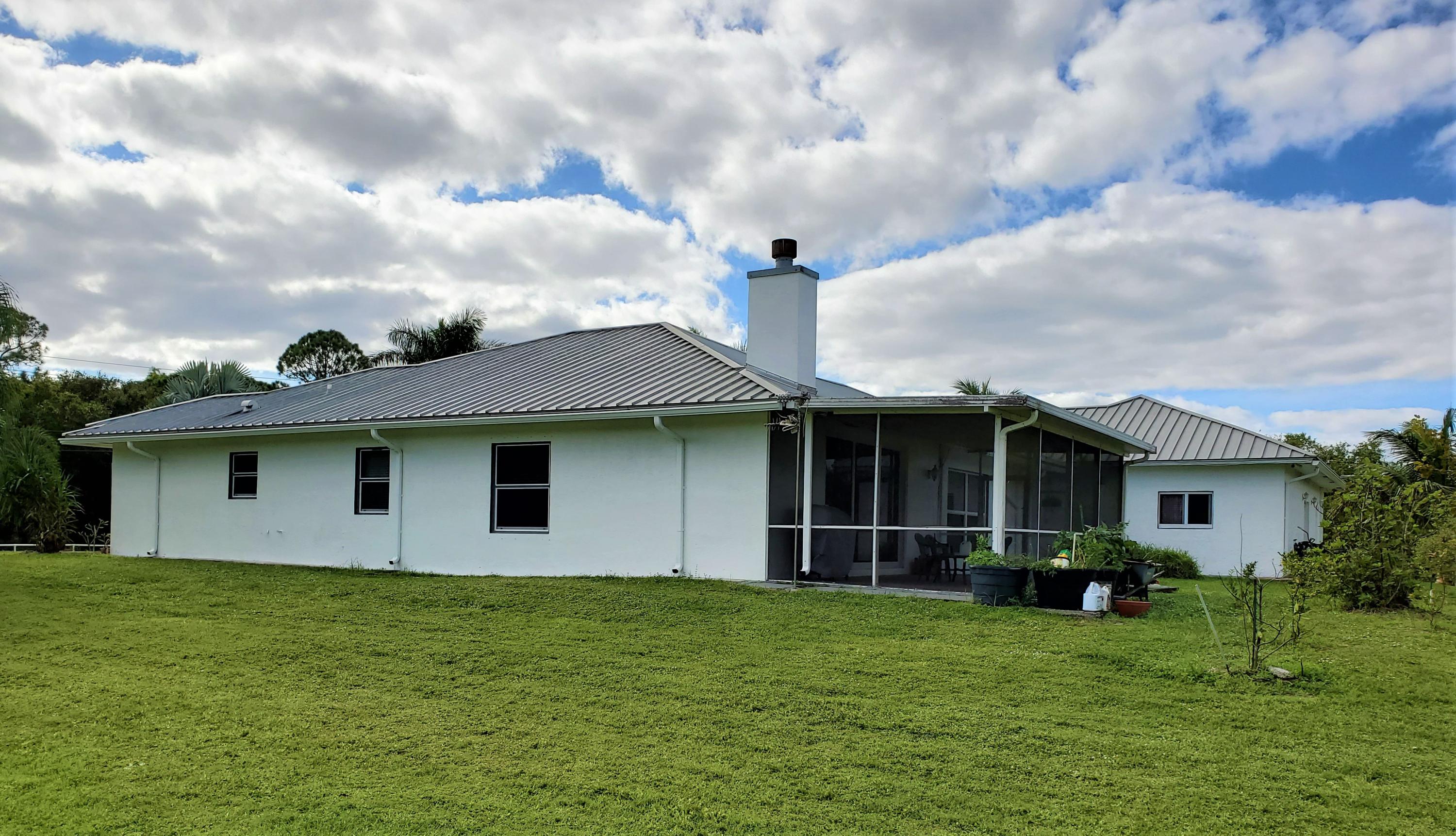 9897 Sandy Run Road Jupiter, FL 33478 - Photo 24 of 30 a view of a back yard of the house