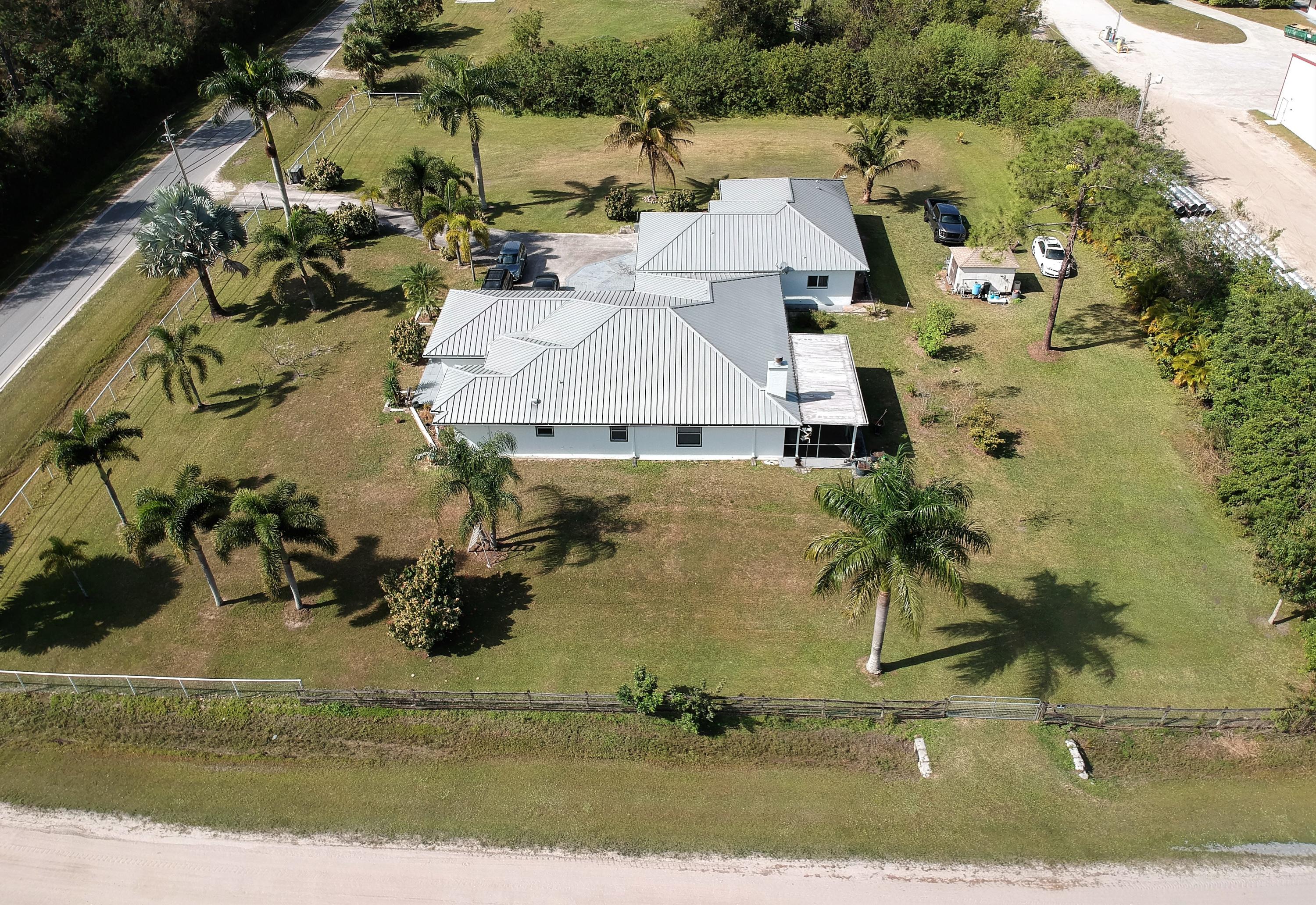 9897 Sandy Run Road Jupiter, FL 33478 - Photo 28 of 30 an aerial view of a house with a yard