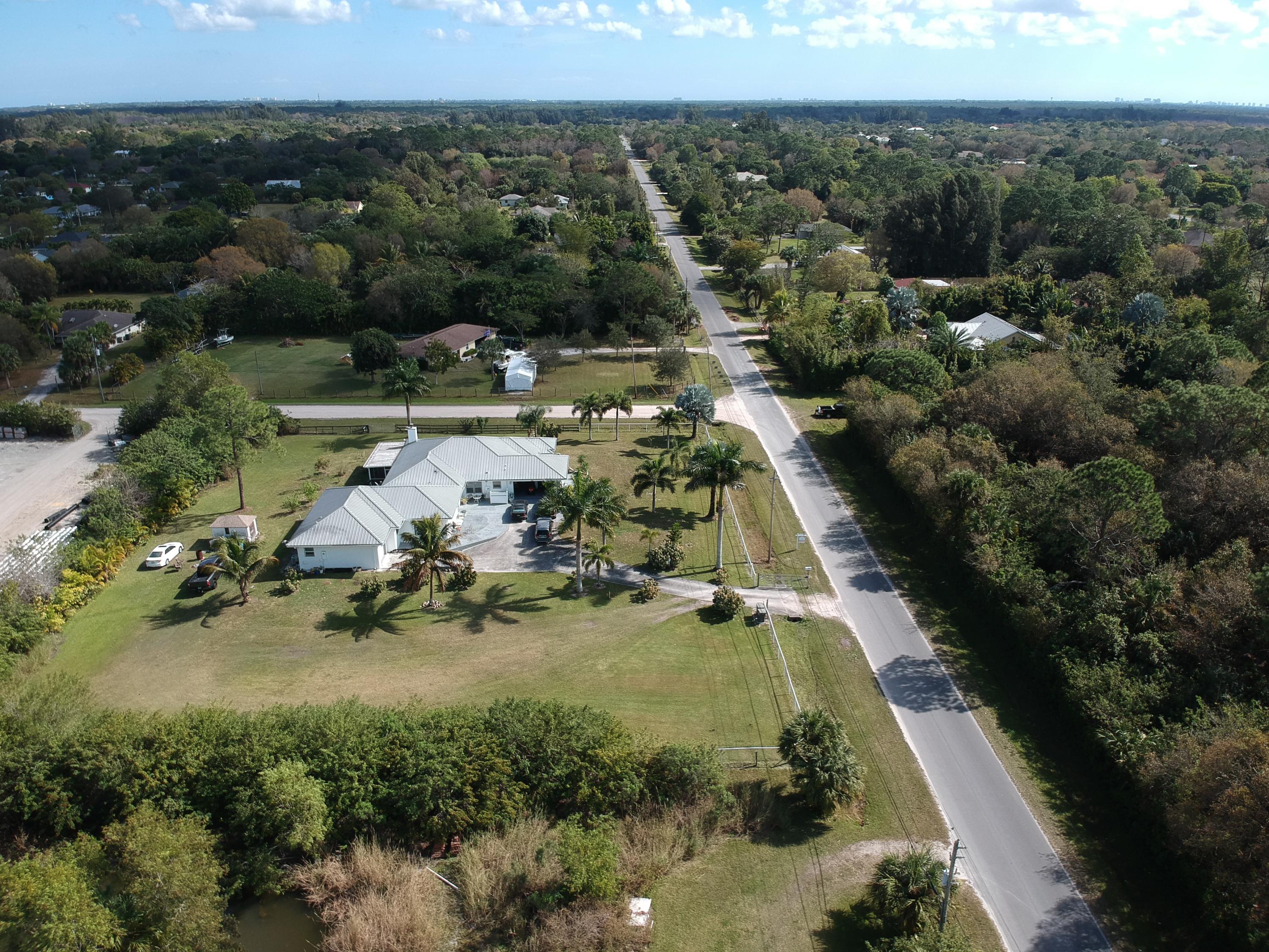 9897 Sandy Run Road Jupiter, FL 33478 - Photo 30 of 30 an aerial view of a house with a yard
