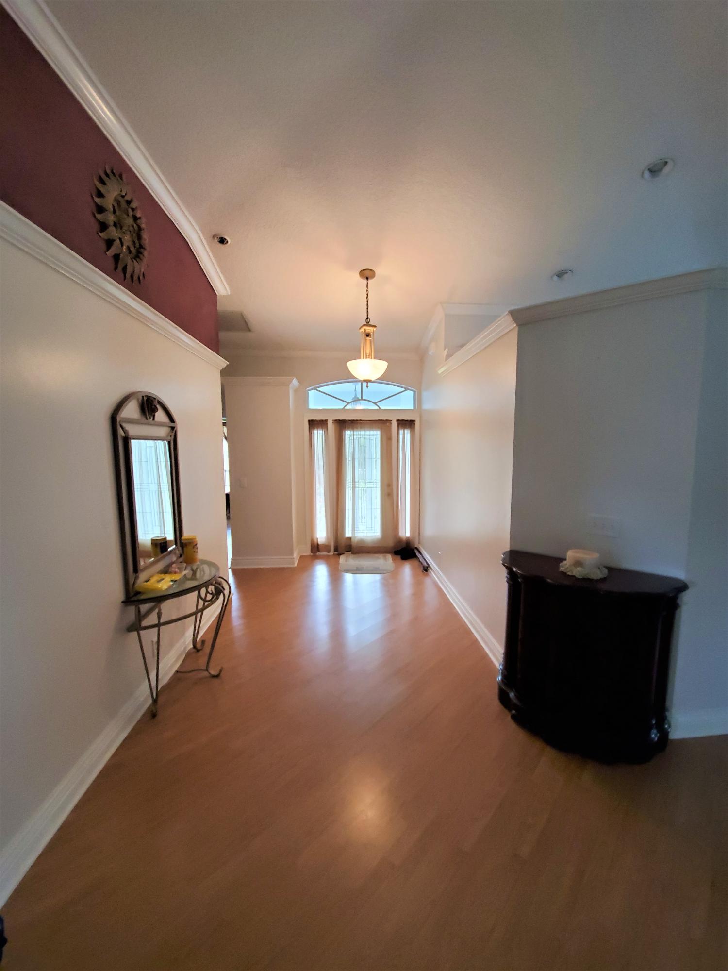 9897 Sandy Run Road Jupiter, FL 33478 - Photo 3 of 30 a living room with furniture and a window