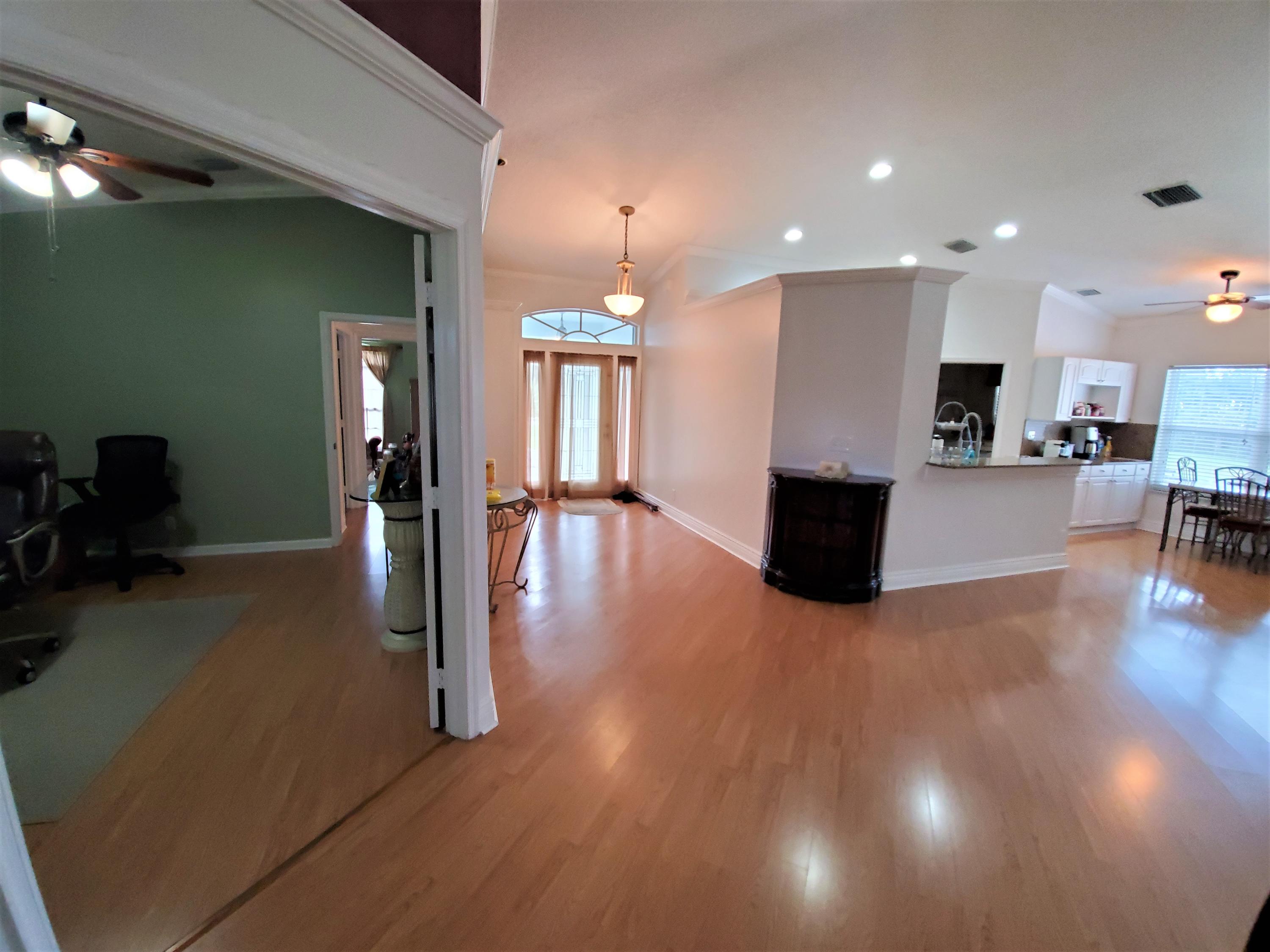 9897 Sandy Run Road Jupiter, FL 33478 - Photo 7 of 30 a view of kitchen with furniture and wooden floor