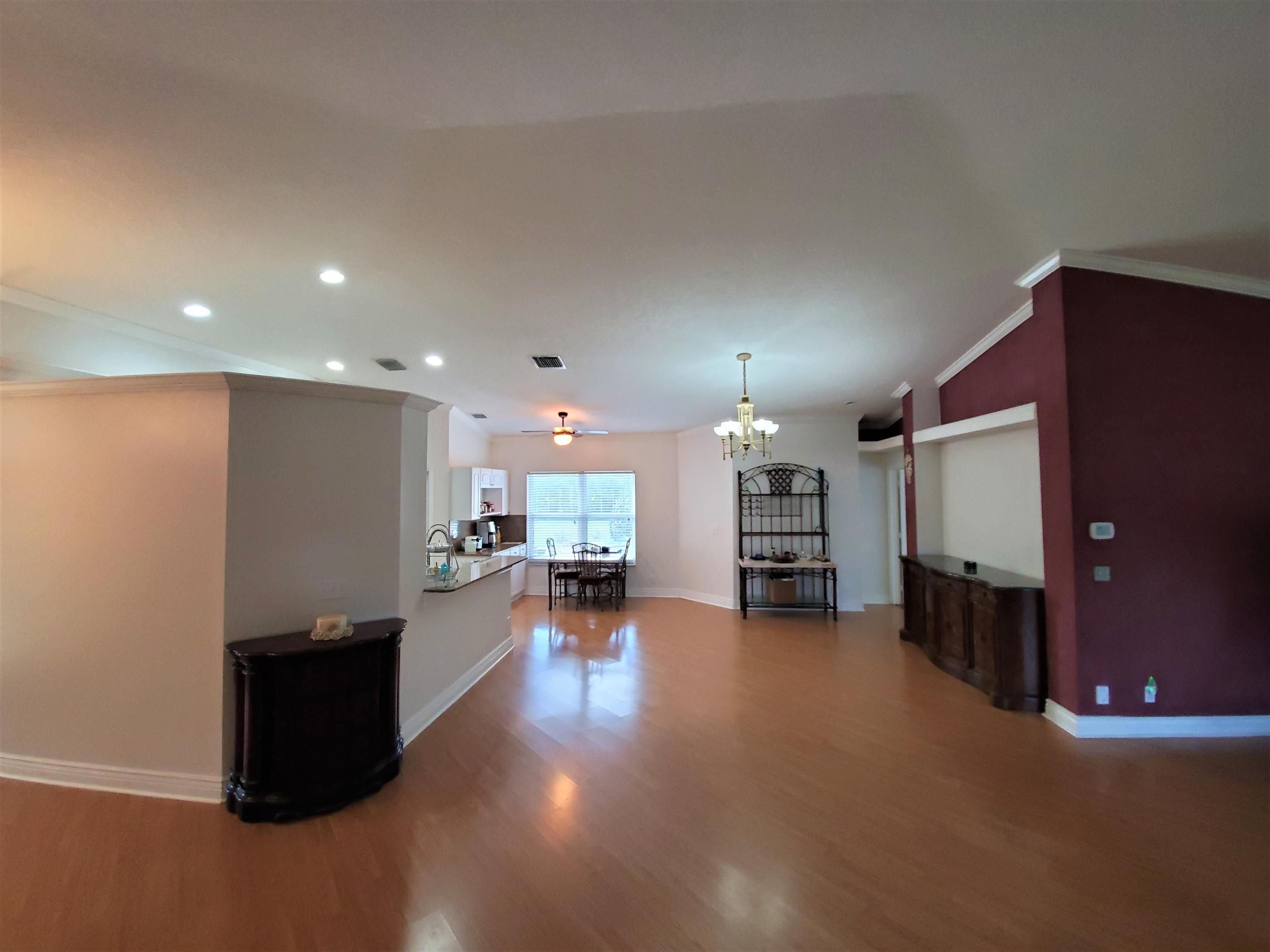 9897 Sandy Run Road Jupiter, FL 33478 - Photo 8 of 30 a view of a living room with furniture and a kitchen
