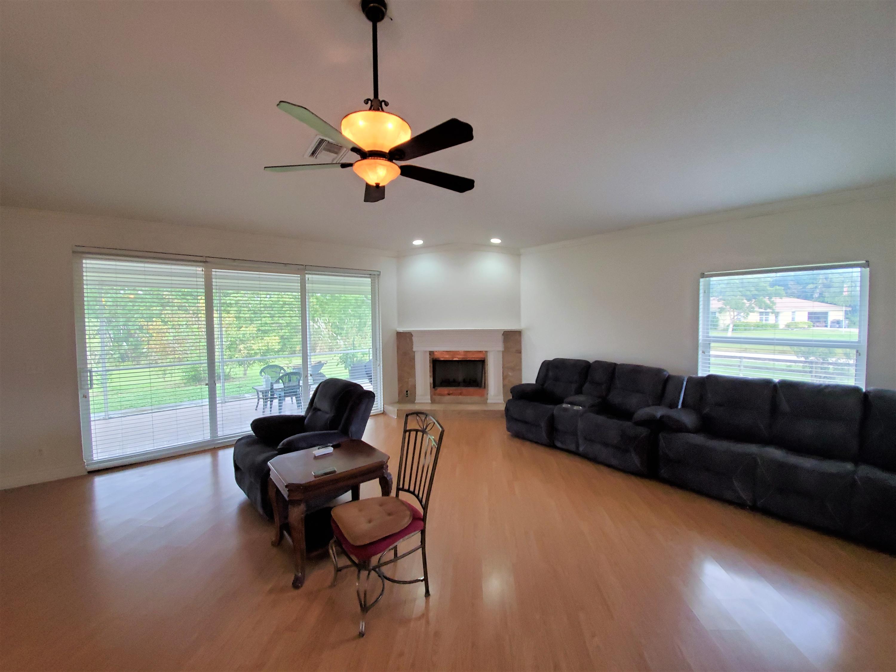 9897 Sandy Run Road Jupiter, FL 33478 - Photo 9 of 30 a living room with furniture and a window