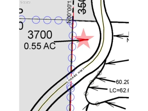 a sign that is on the wall with a window in the background