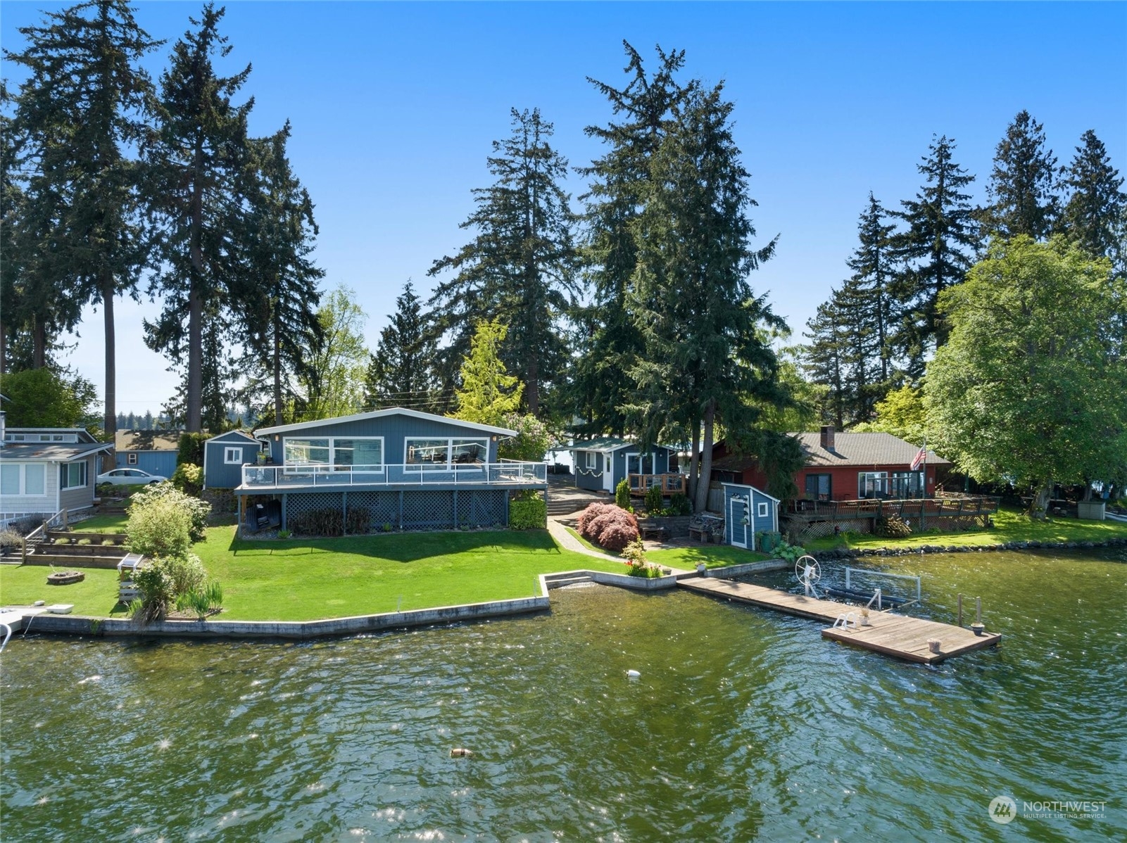 16117 Peninsula Road Stanwood, WA 98292 - Photo 1 of 1 a view of a house with a yard porch and sitting area