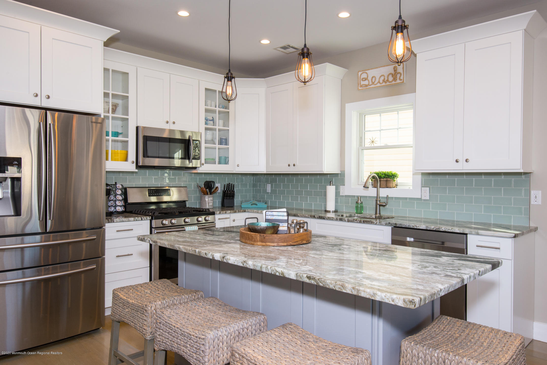 210 Johnson Road Lavallette, NJ 08735 - Photo 12 of 48 a kitchen with a refrigerator a sink a stove and chairs