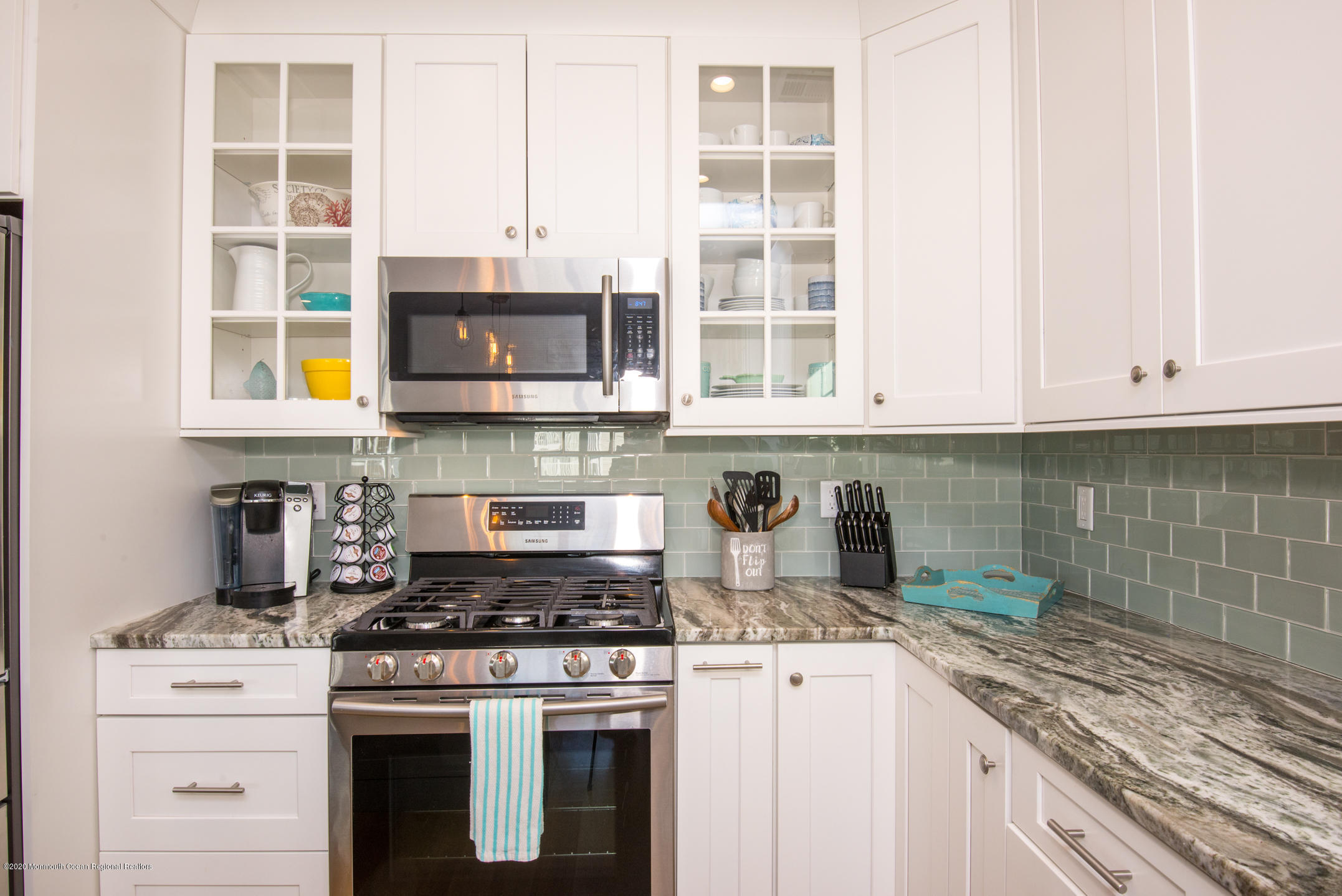 210 Johnson Road Lavallette, NJ 08735 - Photo 14 of 48 a kitchen with stainless steel appliances granite countertop a stove and a microwave