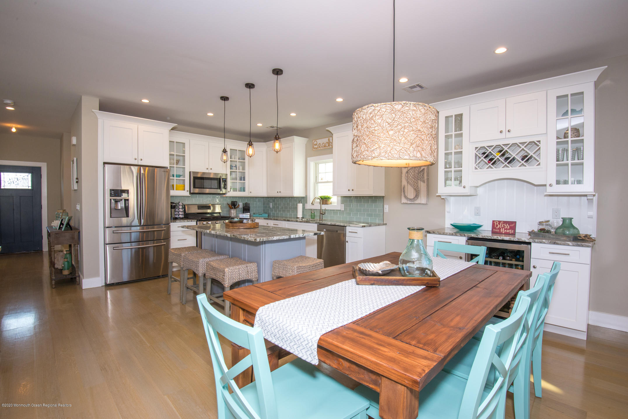 210 Johnson Road Lavallette, NJ 08735 - Photo 16 of 48 a kitchen with a dining table chairs refrigerator and microwave