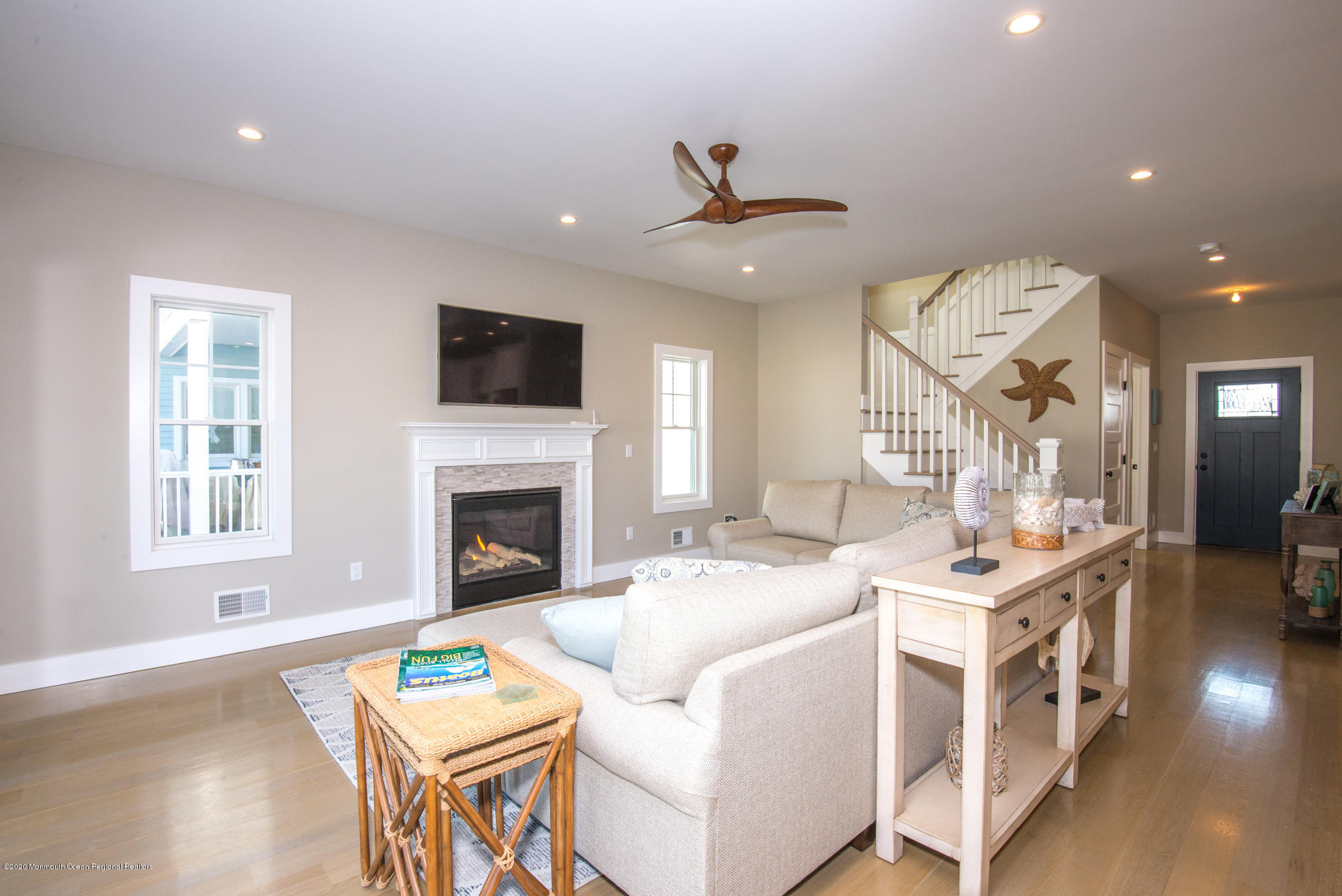 210 Johnson Road Lavallette, NJ 08735 - Photo 18 of 48 a living room with furniture a fireplace and a flat screen tv