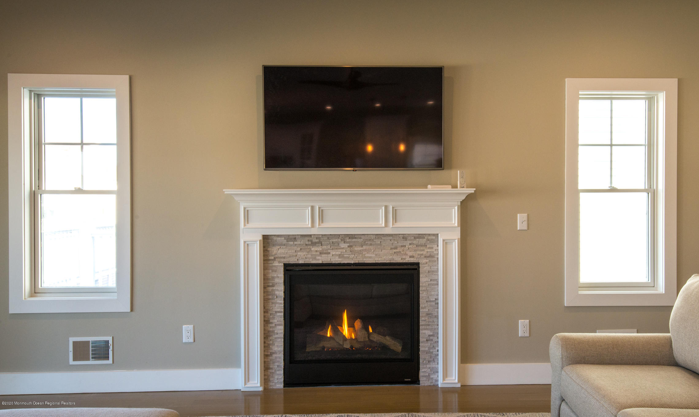 210 Johnson Road Lavallette, NJ 08735 - Photo 19 of 48 a living room with a fireplace and window