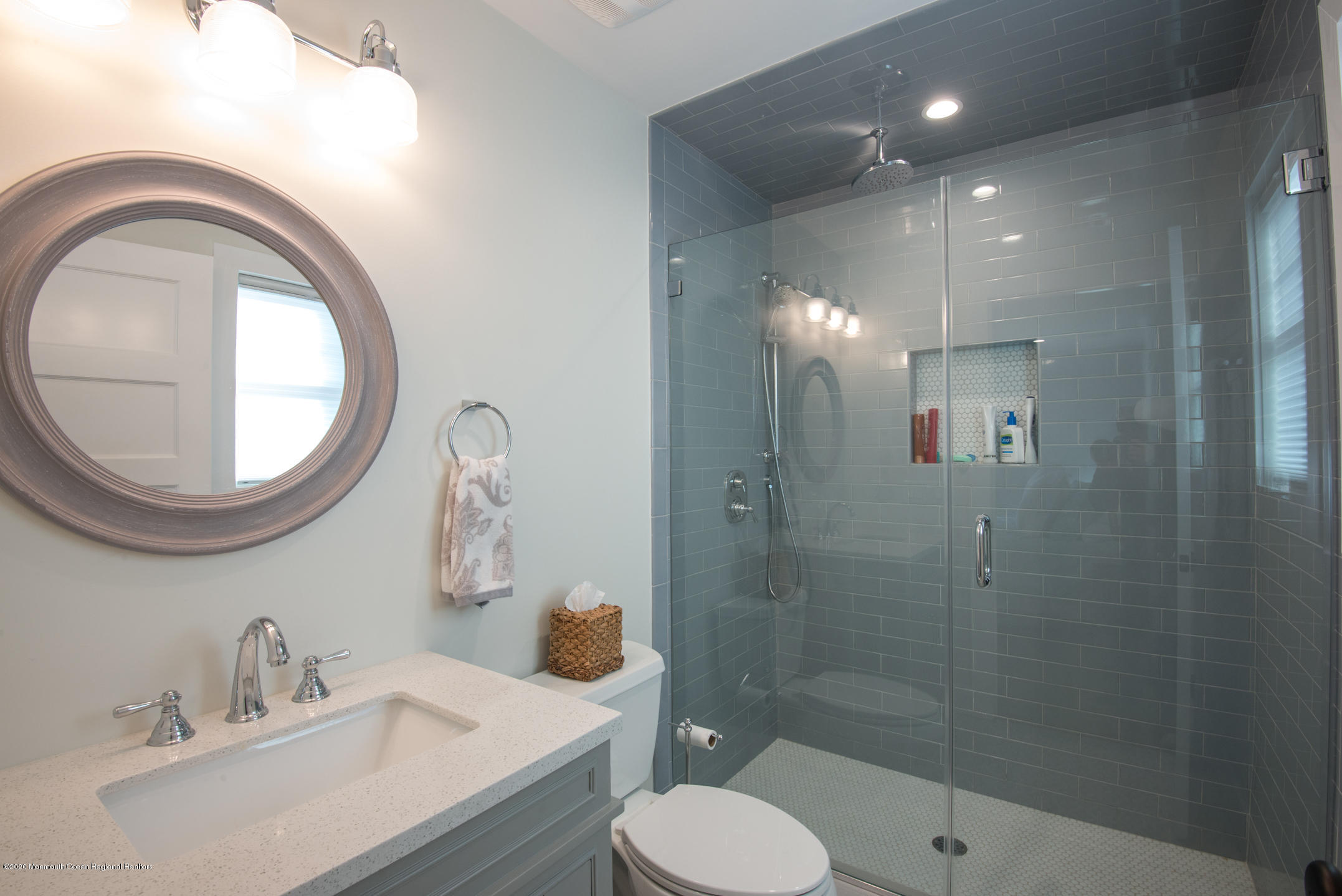 210 Johnson Road Lavallette, NJ 08735 - Photo 36 of 48 a bathroom with a sink a toilet and a mirror