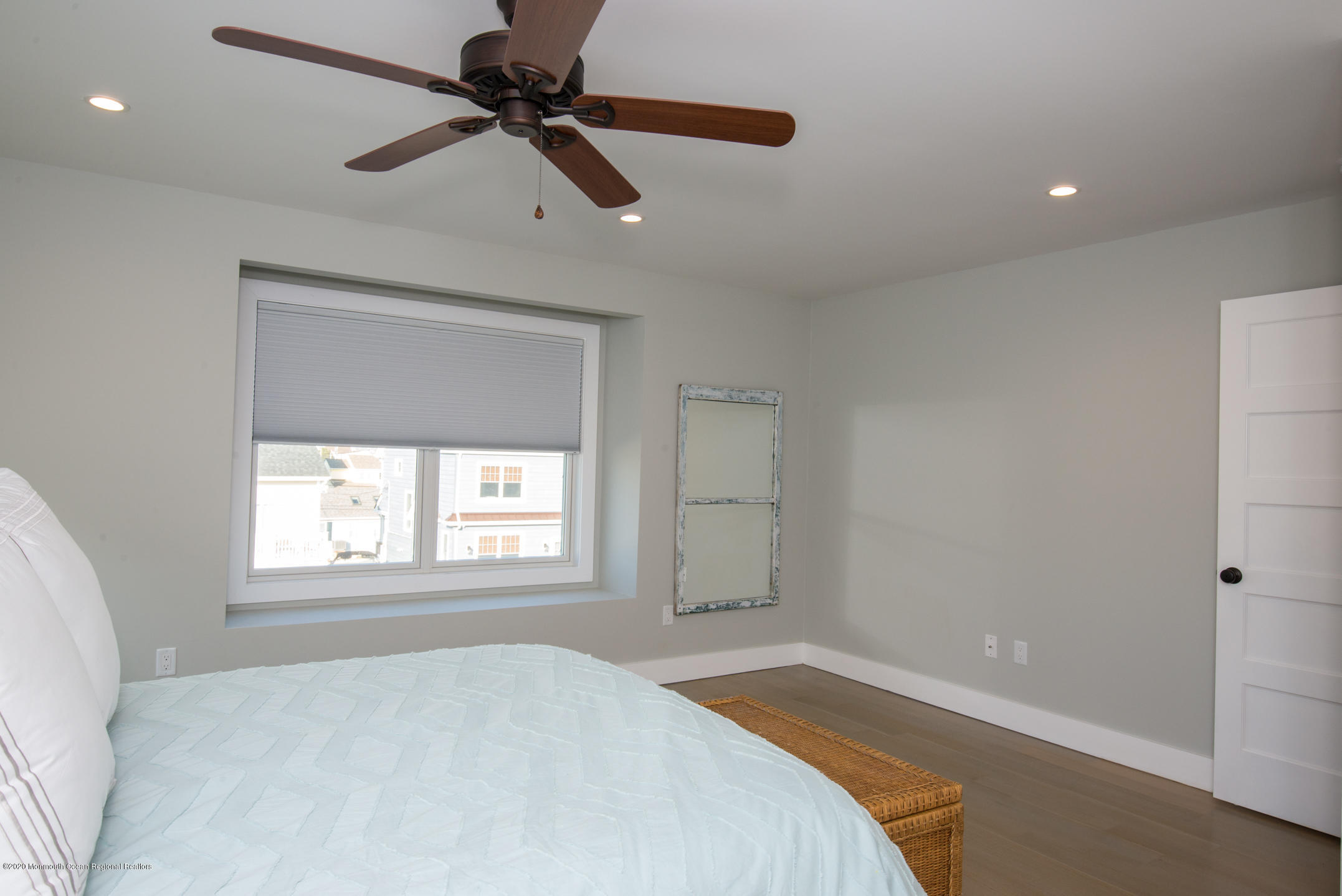 210 Johnson Road Lavallette, NJ 08735 - Photo 38 of 48 a bedroom with a window and a chandelier fan
