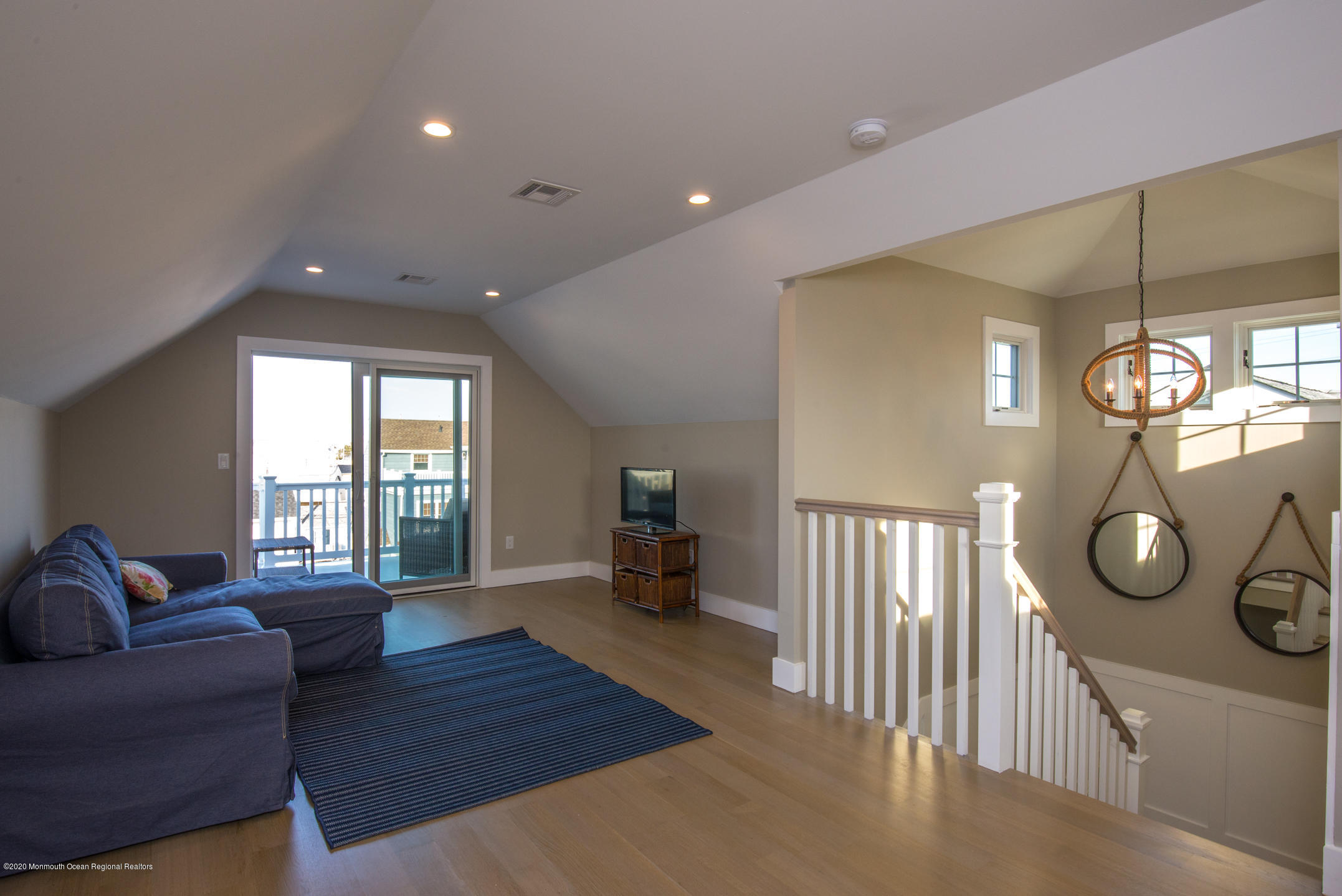 210 Johnson Road Lavallette, NJ 08735 - Photo 44 of 48 a living room with furniture a window and a chandelier