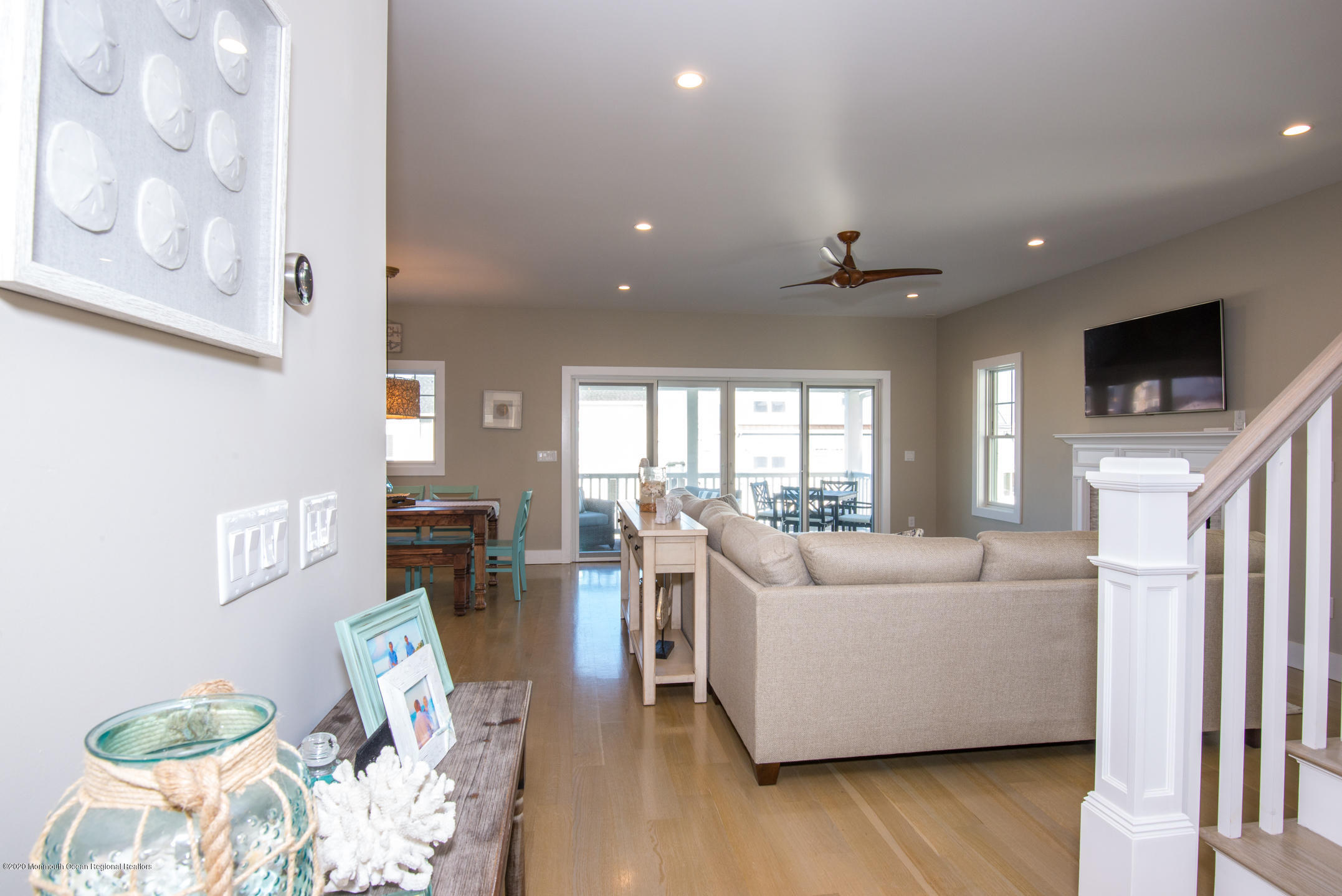 210 Johnson Road Lavallette, NJ 08735 - Photo 7 of 48 a living room with furniture a flat screen tv and a large window
