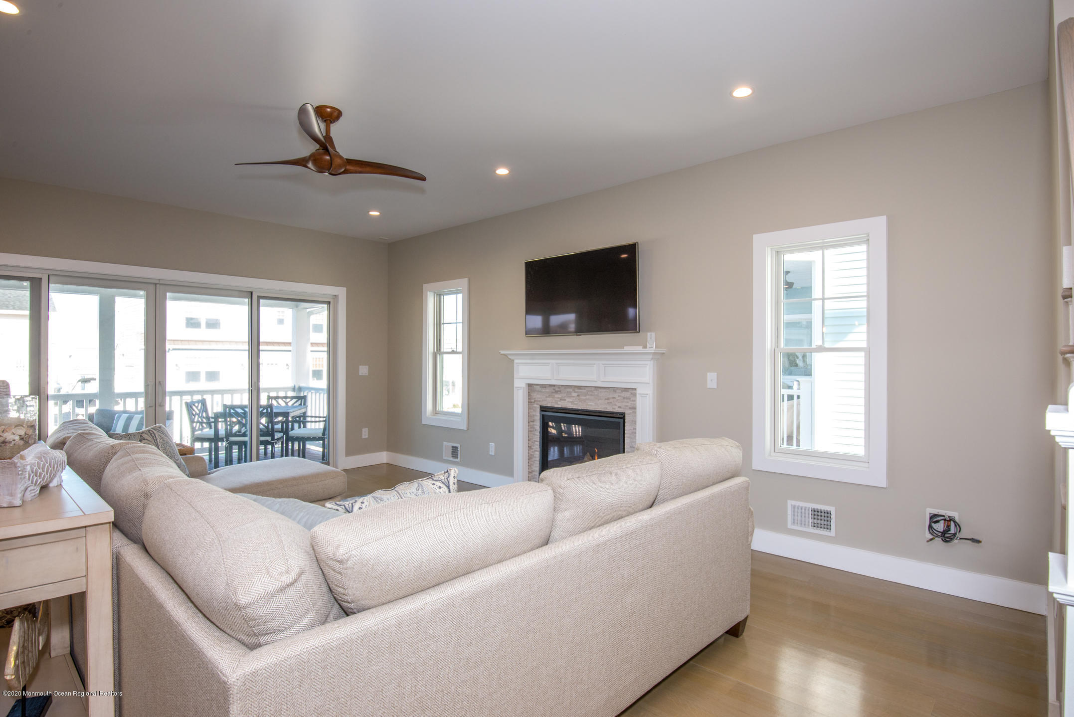 210 Johnson Road Lavallette, NJ 08735 - Photo 8 of 48 a living room with furniture a fireplace and a flat screen tv