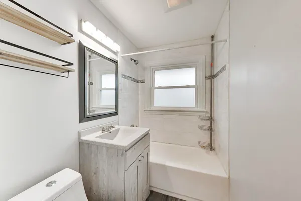 a bathroom with a sink a toilet and a bathtub