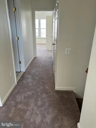 a view of a house with a door and wooden floor