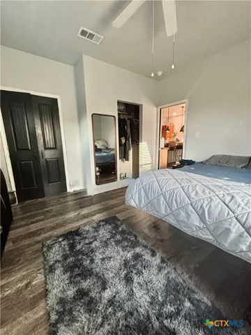 a large white kitchen with a large window