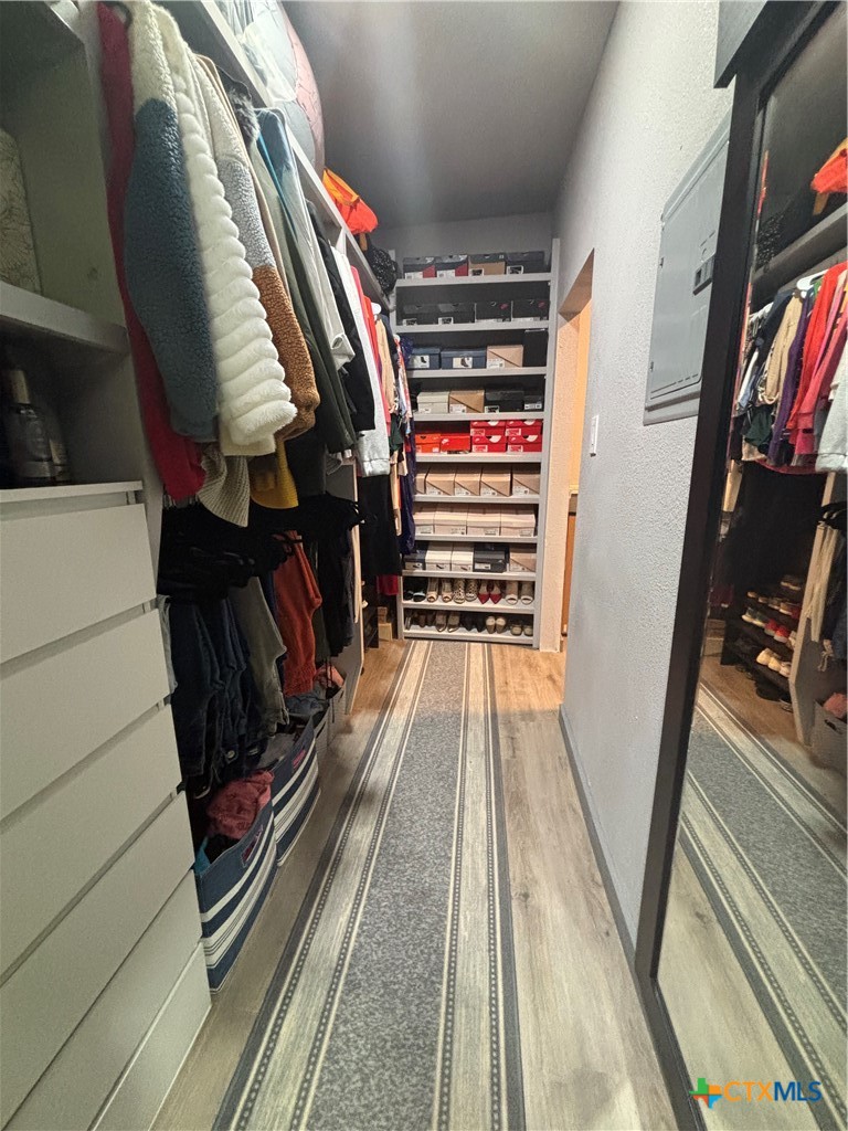 1754 West Big Elm Road Troy, TX 76579 - Photo 24 of 31 a view of walk in closet with clothes and shoes