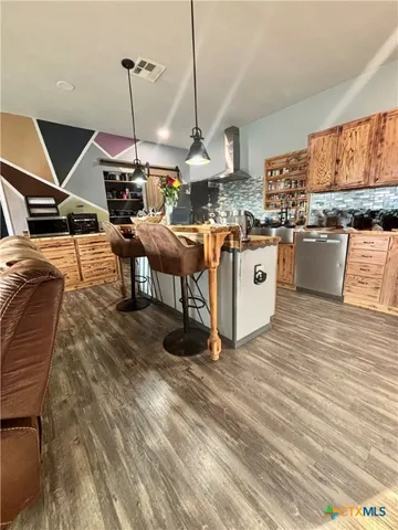 a bedroom with a bed and glass table