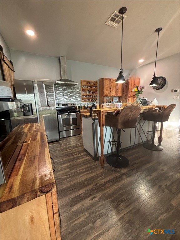 1754 West Big Elm Road Troy, TX 76579 - Photo 8 of 31 a view of a kitchen with kitchen island a counter top space a sink and wooden floor