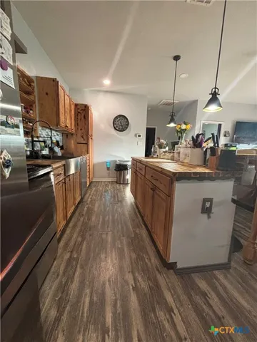a living room with furniture gym equipment and a large window