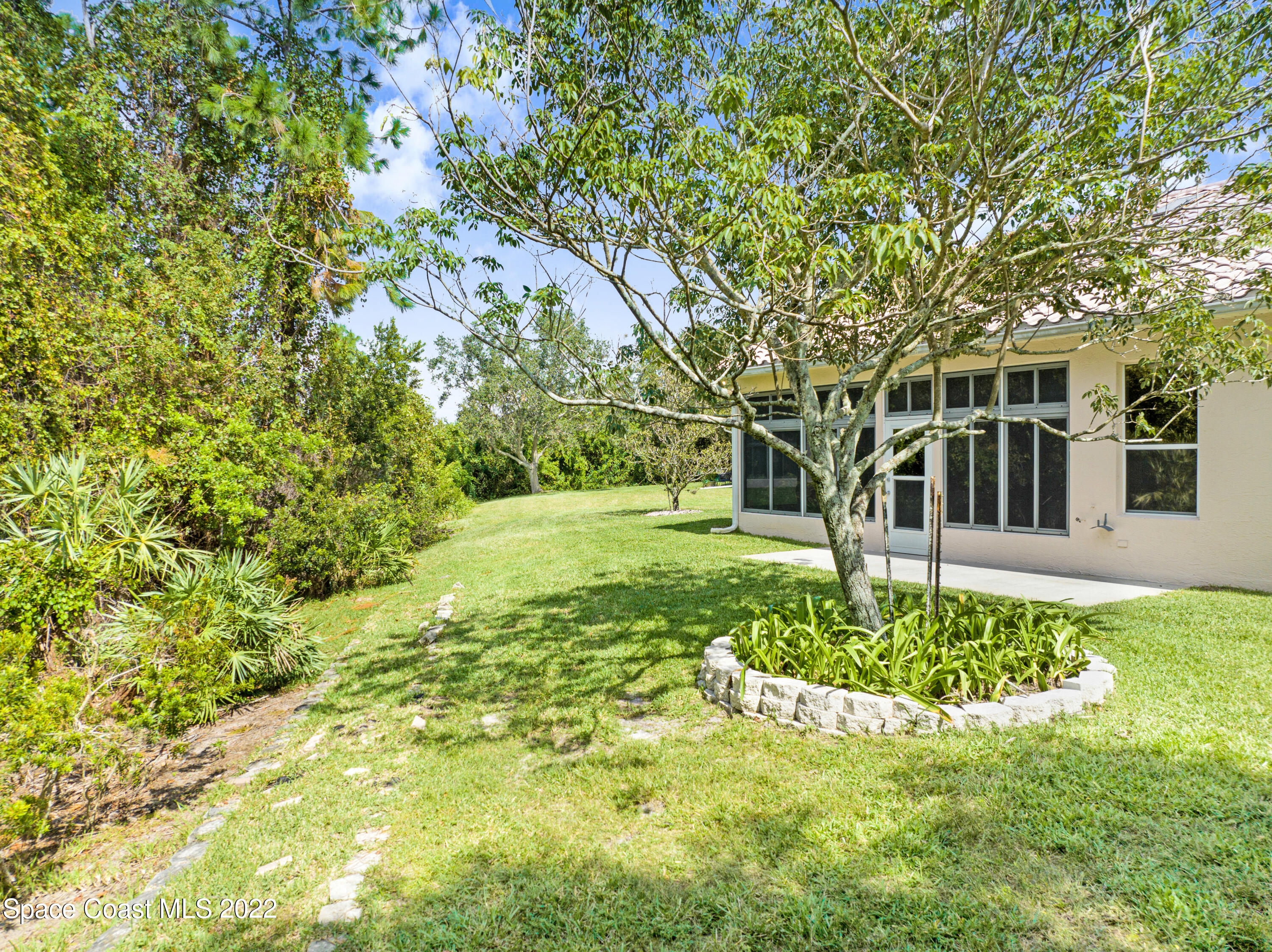 348 Renaissance Avenue Melbourne, FL 32940 - Photo 25 of 31 a view of a house with a yard