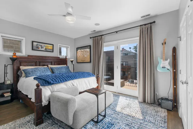 a bedroom with a bed and glass door