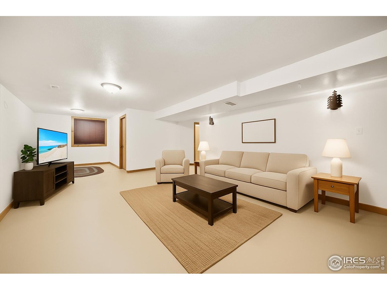 17680 County Rd Q.8 Fort Morgan, CO 80701 - Photo 18 of 40 a living room with furniture and a flat screen tv