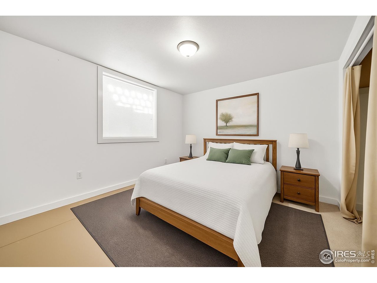 17680 County Rd Q.8 Fort Morgan, CO 80701 - Photo 19 of 40 a bed room with a bed and a night stand