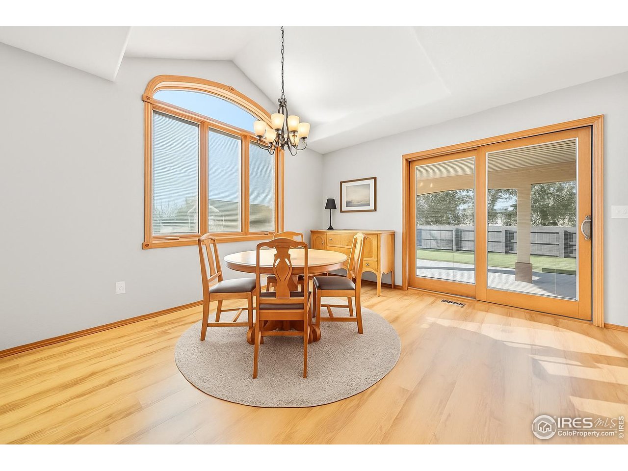 17680 County Rd Q.8 Fort Morgan, CO 80701 - Photo 7 of 40 a dining room with furniture a chandelier and wooden floor