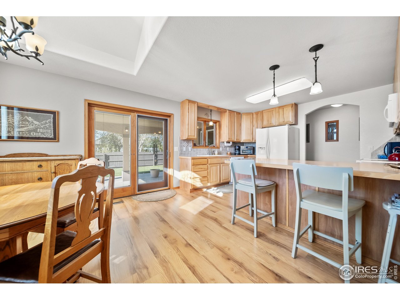 17680 County Rd Q.8 Fort Morgan, CO 80701 - Photo 8 of 40 a view of a dining room with furniture and a chandelier
