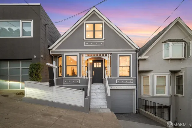 a living room with furniture and a mirror