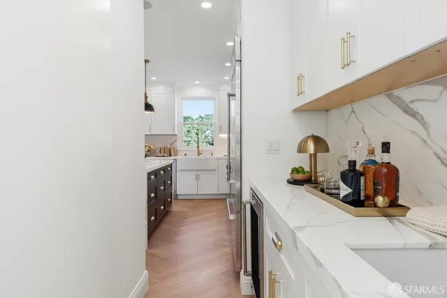 a kitchen with a sink stove and refrigerator