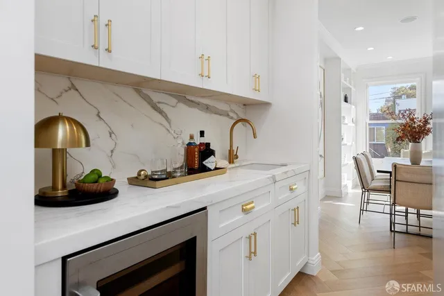 a kitchen with stainless steel appliances a white stove top oven and sink