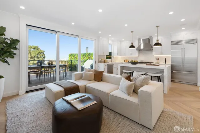 a bedroom with bed and a large window