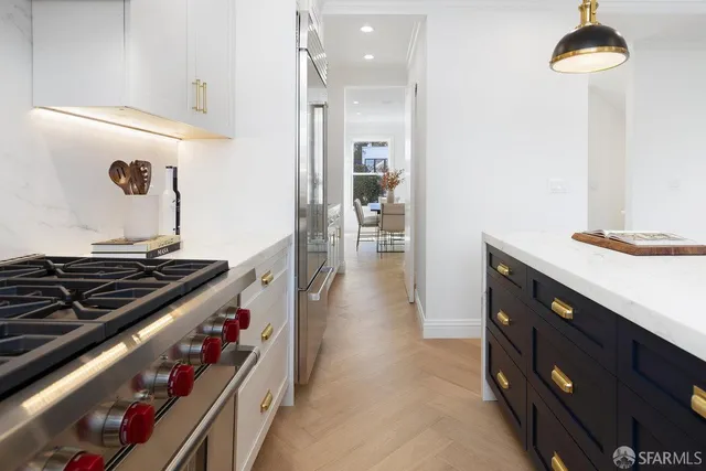 a balcony with outdoor seating and wooden floor