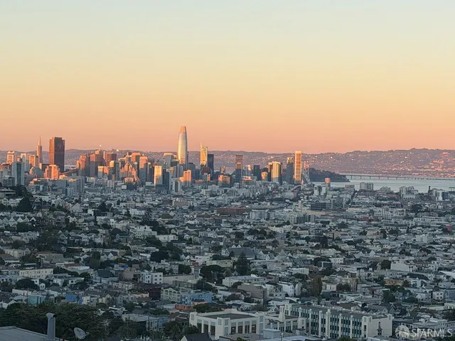 a view of a dining room with furniture and a potted plant