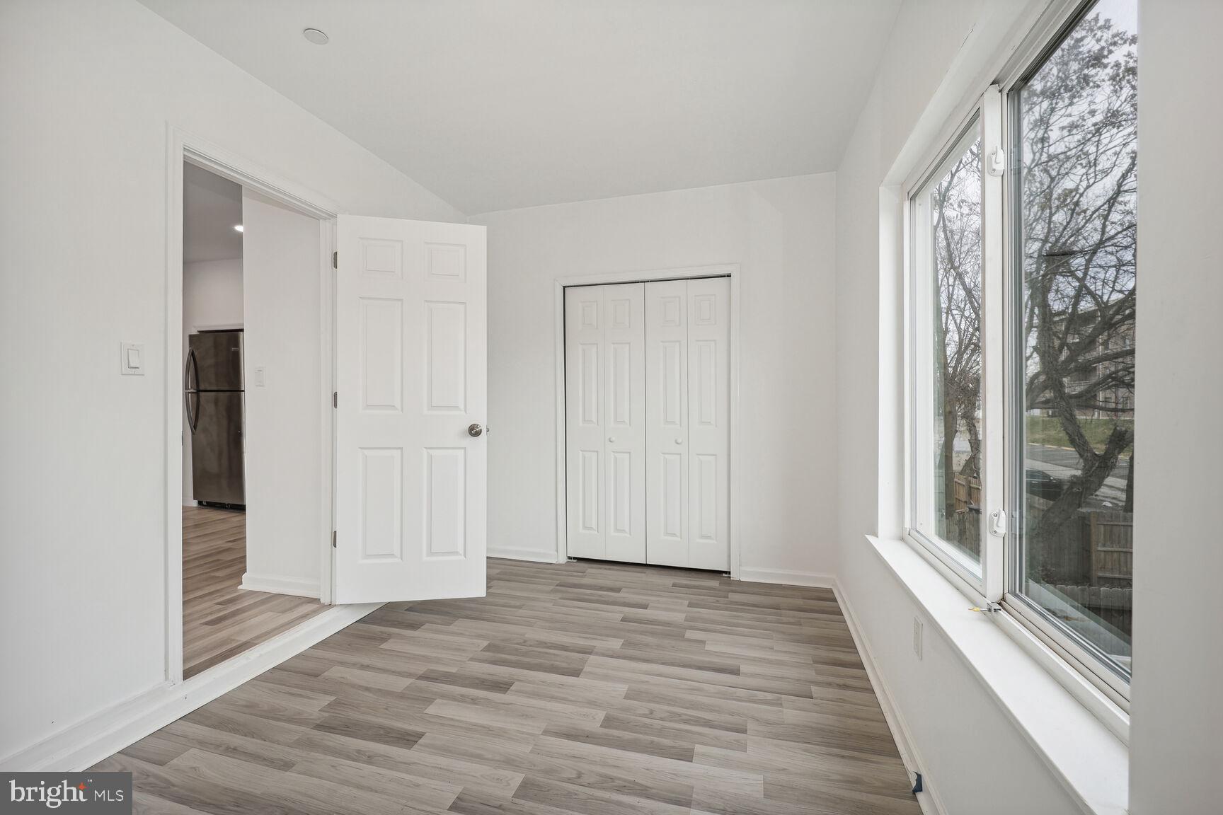 1642 16th Street Southeast, Unit 3 Washington, DC 20020 - Photo 15 of 22 a view of a room with wooden floor and gate