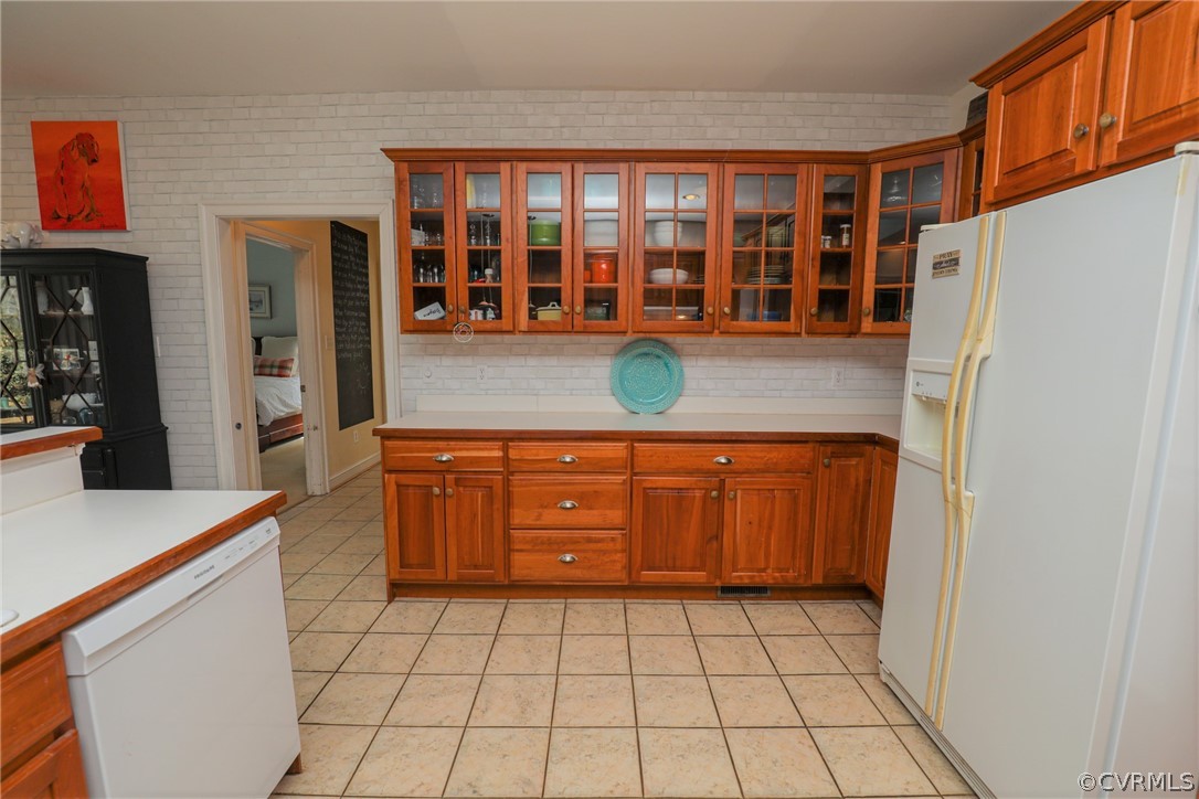 11708 Winterpock Road Chesterfield, VA 23838 - Photo 19 of 50 a kitchen with a sink a stove and cabinets