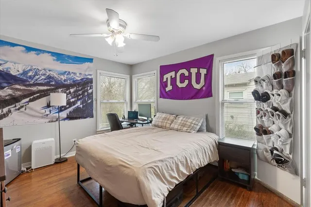 a bedroom with a bed and a chandelier