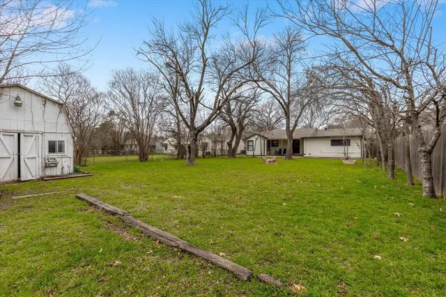 a view of a house with a big yard