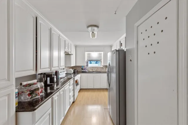 a bathroom with a double vanity sink and mirror