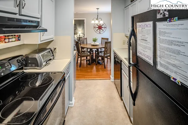 a kitchen with a stove and a microwave